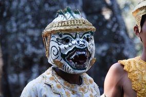 Chinese theater mask on the person