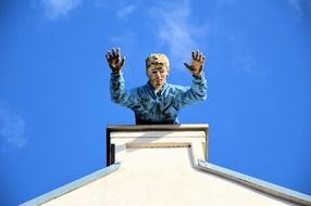 man doll rooftop
