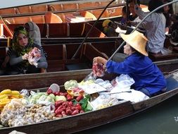 trader on the boat in Thailand