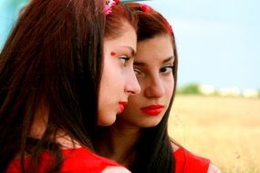 a reflection of a girl with a red lipstick in the mirror