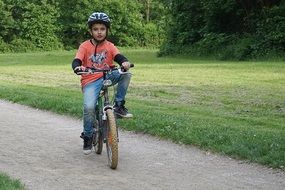 child in a helmet on the sport bike