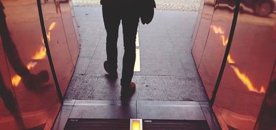 man walking in doorway