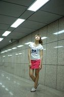 Asian girl in the corridor under the lights