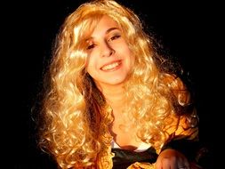 portrait of a girl with yellow hair in the dark