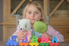 girl Yana with soft toys