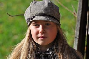 child girl face long hair blond hat