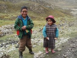 two tribal kids at road, peru