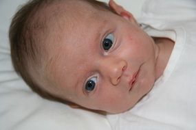 portrait of a newborn with blue eyes
