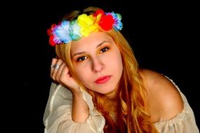 portrait of the nice blonde girl in a wreath with bright makeup