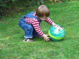 little baby playing ball