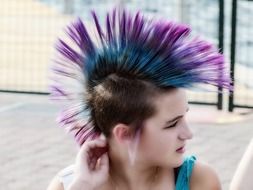 portrait of young girl with hair in punk style
