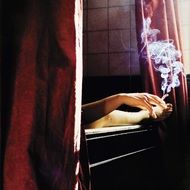 smoking person in bathroom smoke around