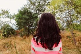 girl dark long haired young back view