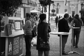 people in open air cafe on street