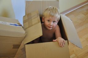 baby in paper box