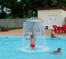 children having fun in the swimming pool