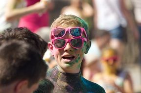 cheerful boy with two glasses