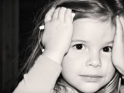 black and white photo of a little girl