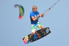 Man is engaged in kite surfing