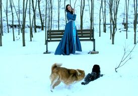 girl in blue dress near the bench