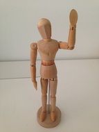 wooden man on the windowsill