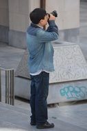 chinese tourist with camera