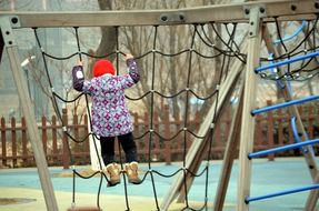 little girl playing on the playground