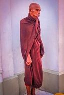 buddhist priest near the wall