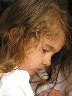 profile portrait of a thoughtful little girl