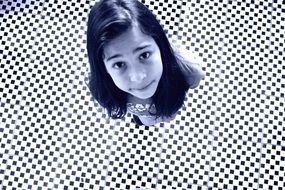 girl on the black and white floor