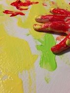 hands of a child in bright colors