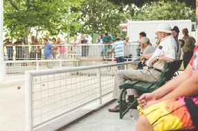 elderly people in the park on a bench