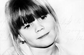 black and white portrait of a little girl smiling