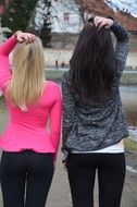 blonde and brunette back view