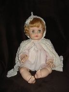 antique doll in a white dress