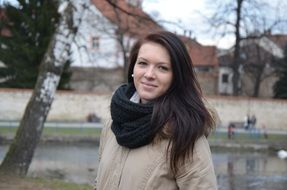 brunette with a black scarf on the promenade