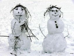 two snowmen in the snow