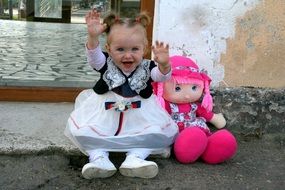 Happy girl with the doll