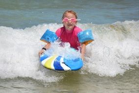 girl riding on bodyboard