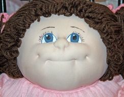 Adorable doll with big cheeks