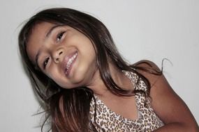 dark little girl with a smile
