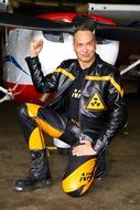 young man in leather suit