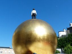 man on a gold ball in Salzburg