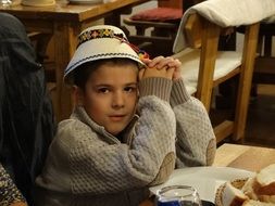 child boy in traditional hat, romania, maramures