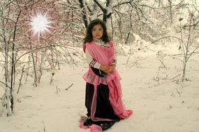 girl in a dress in the snow