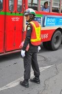 a policeman on the street in Bangkok