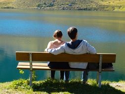 couple on the bench at the lake