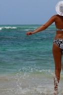 figure of a girl in a bathing suit in the ocean