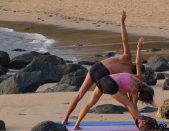 a man and a woman do the exercise on the west coast of India, Gokarna, Karnataka