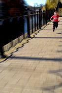 boy running on a street